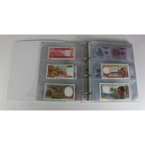 905 - World, Africa (151) a superb collection of Uncirculated notes in an album, Algeria, Angola, Biafra, ... 