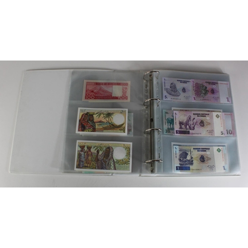 905 - World, Africa (151) a superb collection of Uncirculated notes in an album, Algeria, Angola, Biafra, ... 