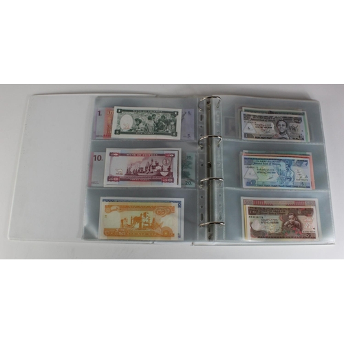 905 - World, Africa (151) a superb collection of Uncirculated notes in an album, Algeria, Angola, Biafra, ... 