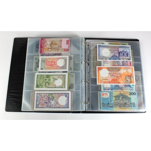 907 - World, Asia (171) collection in an album, the majority Uncirculated, Afghanistan, Azerbaijan, Bangla... 