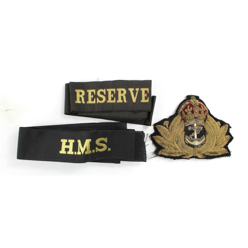 1008 - Royal Naval officers kings crown hat badge with Royal Fleet Reserve & HMS hat tallys.