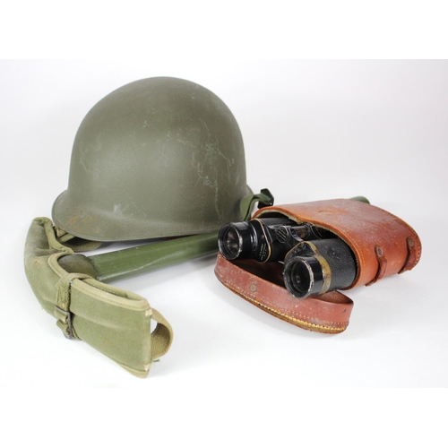 1044 - US helmet with 1945 dated entrenching tool and cover and pair of US army binoculars.