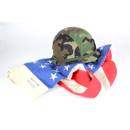 1059 - Vietnam War US flag with US post WW2 helmet steel helmet.