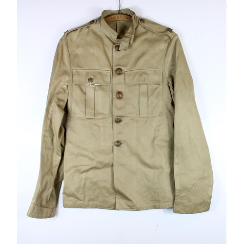 1142 - WW2 Royal Marines soldiers tropical service jacket with RM brass title and kings crown buttons.