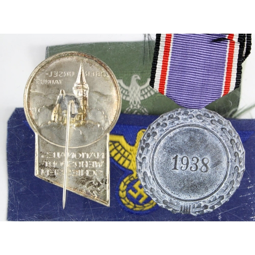 801 - German WW2 Lufftschutz Civil Defence medal with two breast eagle and party rally badge.