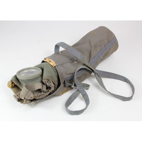 1402 - Gas mask a wartime example of a Swiss type, with original paperwork & spare lenses