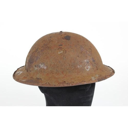 1938 - WW1 British Brodie helmet with most of its original paint finish minus its lining and chin strap.