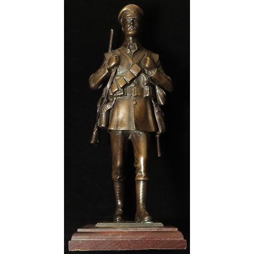 1946 - WW1 interest - a superb heavy bronze statuette of a marching 'Old Contemptible Tommy'. 25cm tall, an... 