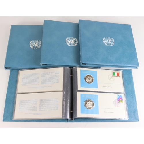 985 - United Nations crown-size sterling silver proof medal and stamp covers (24) 1980-84, FDC in original... 