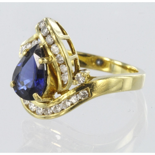 101 - 18ct yellow gold stylised cluster ring set with central pear shaped sapphire and surrounded by round... 