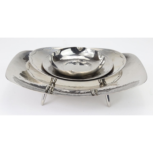 1015 - Two Keswick School stainless steel dishes and three Borrowdale Stanless Steel dishes (two matching)