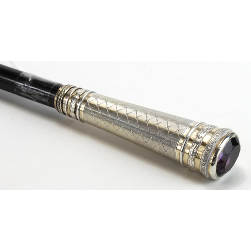 1025 - Walking cane with attractive large silver 900 stamped grip, topped with a large amethyst.  A quali... 