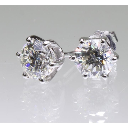 113 - 18ct white gold diamond solitaire stud earrings, two round brilliant cut diamonds with a known total... 