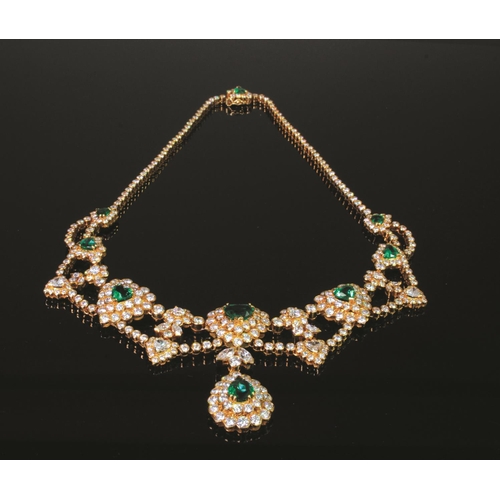 125 - Suite of 18ct yellow gold jewellery, comprising a necklace featuring seven heart shaped graduated em... 