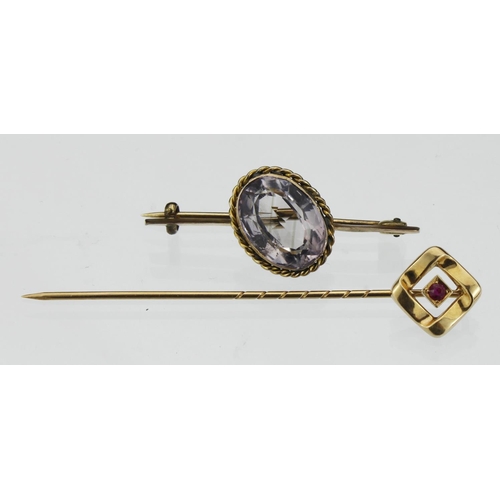 146 - 14ct yellow gold tie pin of square design and set with a single ruby, weight 1.3g. A gold plated ame... 