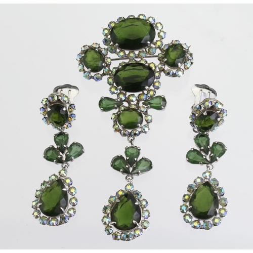 159 - White metal Christian Dior costume brooch set with clusters of green paste stones surrounded by auro... 