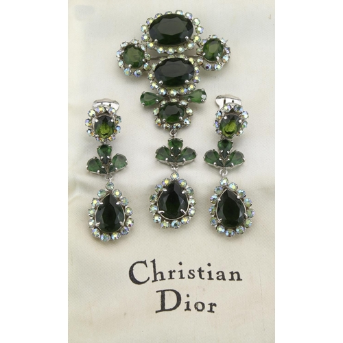 159 - White metal Christian Dior costume brooch set with clusters of green paste stones surrounded by auro... 