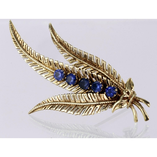 190 - 9ct yellow gold fern leaf spray brooch set with five round 3mm blue stones, rollover catch, length 6... 