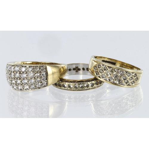 194 - Three 9ct yellow gold rings to include a diamond set band ring, finger size L, weight 2.6g, a domed ... 