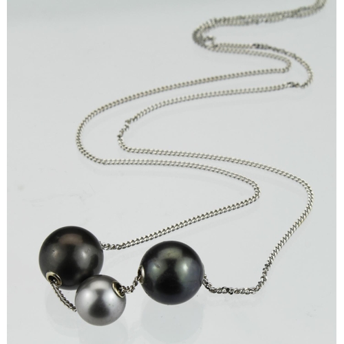 208 - 18ct white gold curb chain with three drilled Tahitian pearls as slider style pendants, length 63cm,... 