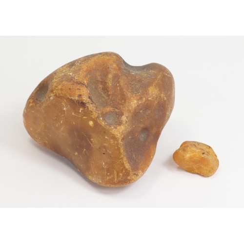 209 - Lump of raw amber (218g) and a small piece (4.7g). From a Suffolk country house.