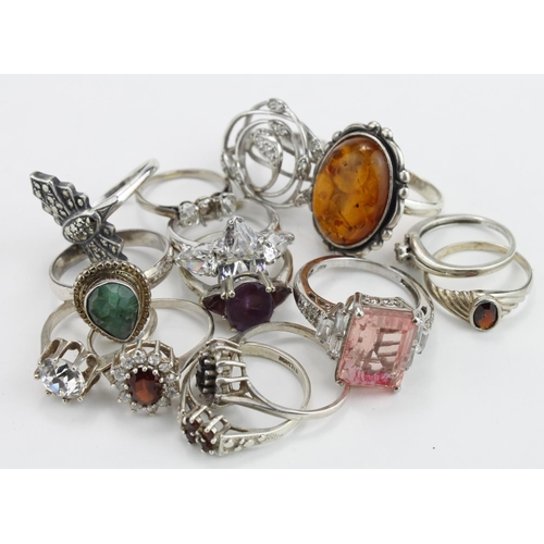 217 - Silver rings. A collection of fourteen silver & white metal rings, many with stones