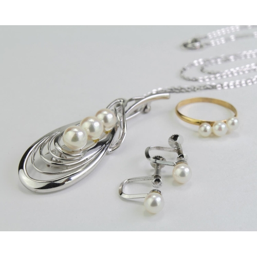 233 - 18ct gold ring set with three pearls, size O, weight 1.4g along with as silver pendant, chain with t... 