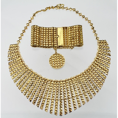 244 - Stamped 22ct, tested as approx. 21ct suite of yellow gold necklace and matching bracelet. The neckla... 