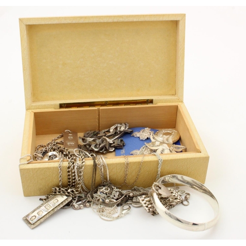 263 - Silver / white metal jewellery in a wooden box, includes gate & identity bracelets, earrings etc.