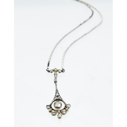 268 - 18ct yellow and white gold necklace comprising a flared pendant measuring approx. 4cm in length set ... 