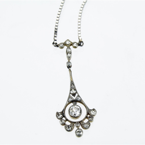 268 - 18ct yellow and white gold necklace comprising a flared pendant measuring approx. 4cm in length set ... 