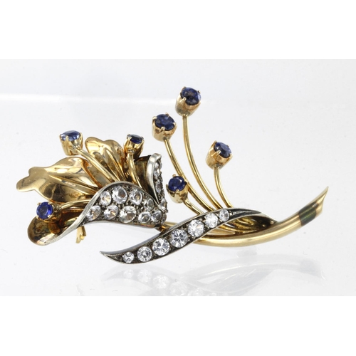 284 - 9ct yellow gold floral spray brooch set with clear and blue paste stones, weight 16.4g