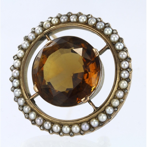 285 - 9ct yellow gold large circular brooch set with central yellow brown quartz surrounded by pearls and ... 