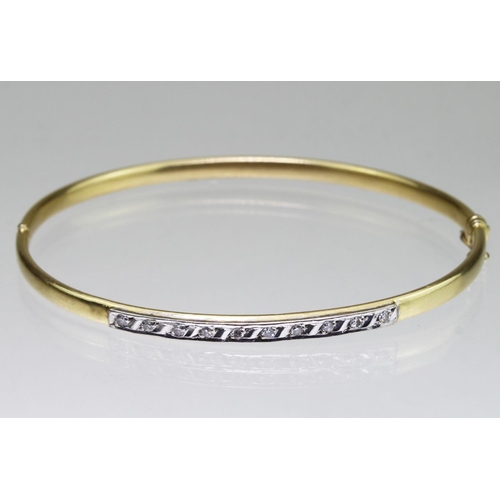 299 - 18ct yellow gold hinged bangle with box clasp and safety catch, set with ten round eight cut diamond... 