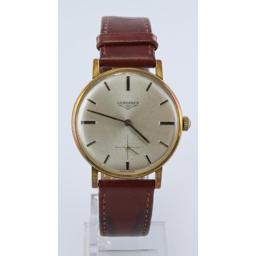 336 - Gents manual wind wristwatch by Longines. The cream dial (some light flecking) with gilt baton marke... 