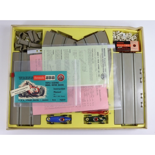 687 - Toy. Wrenn Formula 152 triple electric model motor racing game in original box with instructions.