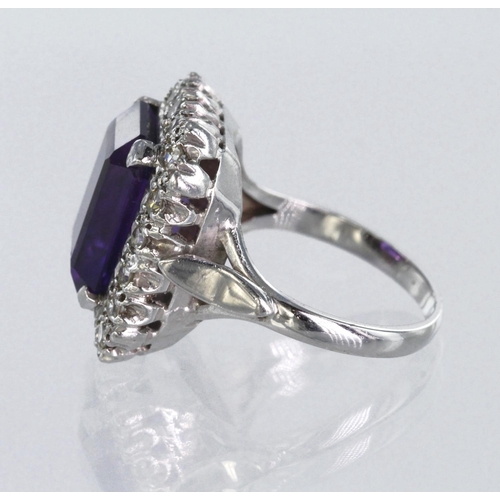 76 - Tests as 18ct white gold cluster ring set with a central rectangular amethyst measuring approx. 12mm... 