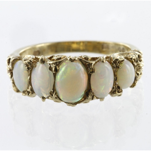 82 - 9ct yellow gold graduated opal five stone carved head ring, finger size P, weight 3.8g