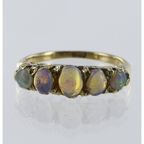 90 - 18ct yellow gold graduated opal five stone carved head ring, finger size M/N, weight 3.9g