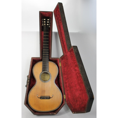 924 - Acoustic Guitar. Late Victorian/ Early 20th century acoustic guitar in wooden coffin shaped carry ca... 