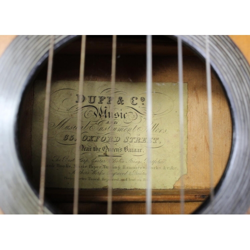 924 - Acoustic Guitar. Late Victorian/ Early 20th century acoustic guitar in wooden coffin shaped carry ca... 