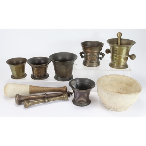 940 - Collection of mortars, some in 17th century manner, and a few pestles (12). One decorated around the... 