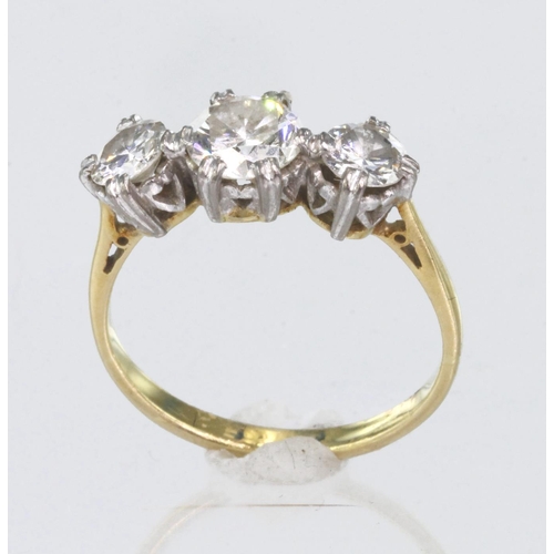 95 - 18ct yellow gold three stone ring consisting of central round brilliant cut diamond calculated as we... 