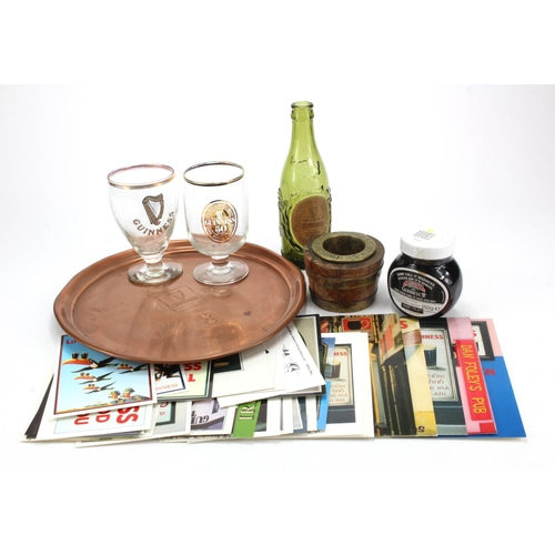 955 - Guinness. A group of Guinness items, comprising wood & brass cask barrel ashtray, a Guinness Tottenh... 