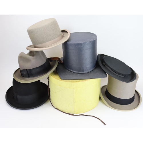 961 - Hats. A collection of early 20th century hats to include; grey Lock & Co. top hat (20cm x16.cm), col... 