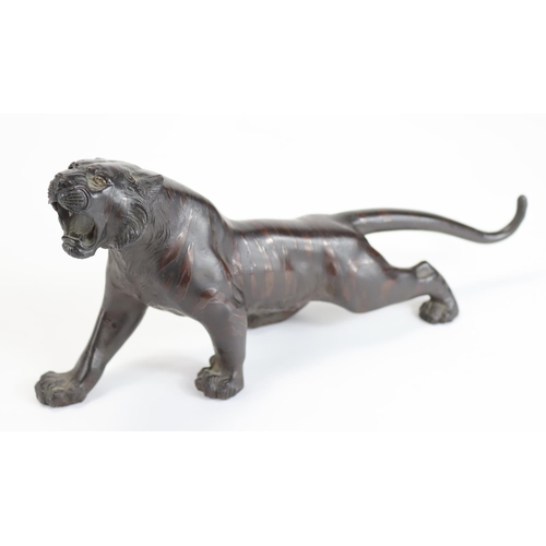 963 - Japanese Meiji signed bronze of a tiger roaring, naturalistically modelled. 25.5cm long