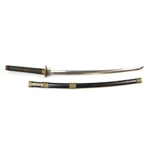 1725 - Japanese sword with black scabbard, blade with light rusting, dragoon illustrated mounts