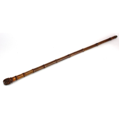 1051 - Bamboo 19th century walking stick with pineapple style grip, and concealed sharp blade,. metal flip ... 