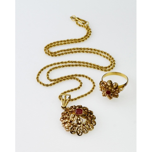 106 - Indian, unmarked 18ct. gold necklace and ring (tested)   Both contain red stones.  Total weight of i... 