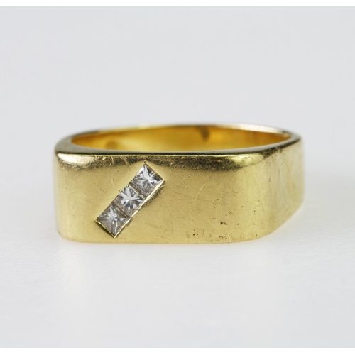 107 - 18ct yellow gold signet style ring set diagonally with three princess cut diamonds weighing a total ... 